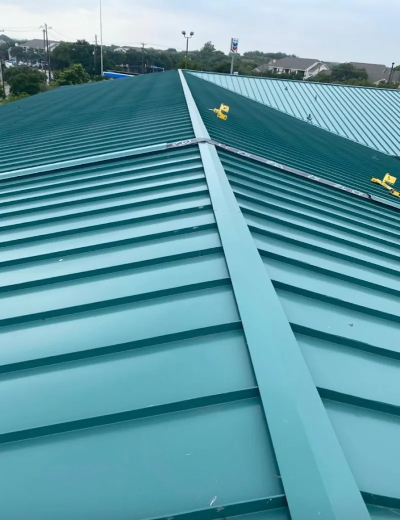 Green commercial metal roof ridge and valley for Metal Roof Repair in Dubuque